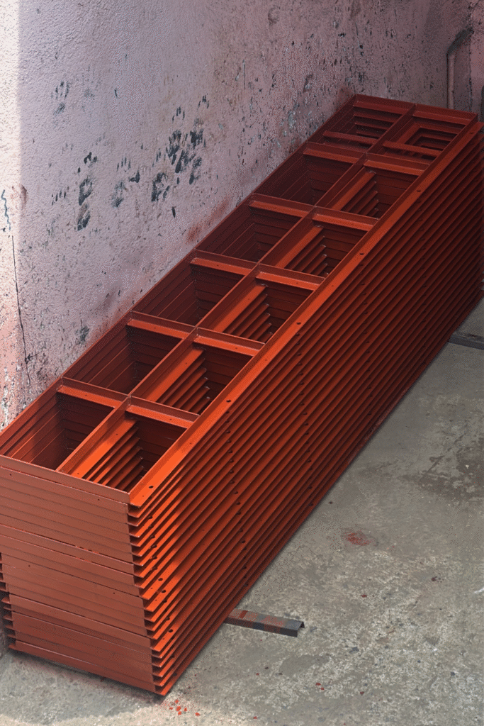 Angle framing and stiffeners on the reverse of wall-form panels.